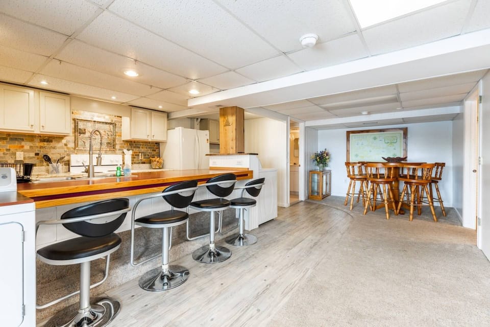 The spacious suite has a full kitchen with a breakfast bar and laundry.
