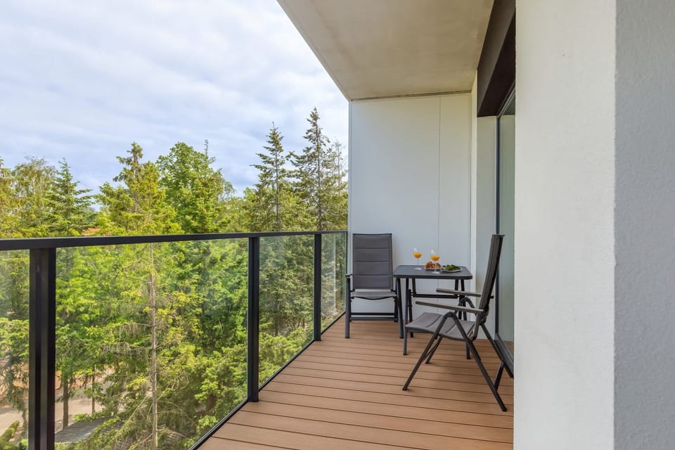 Quiet balcony with garden furniture for relaxation.
