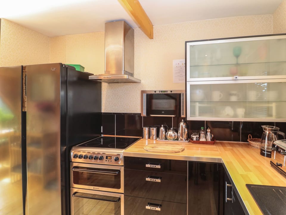 Fridge, electric kettle, toaster, cookware/dishes/utensils
