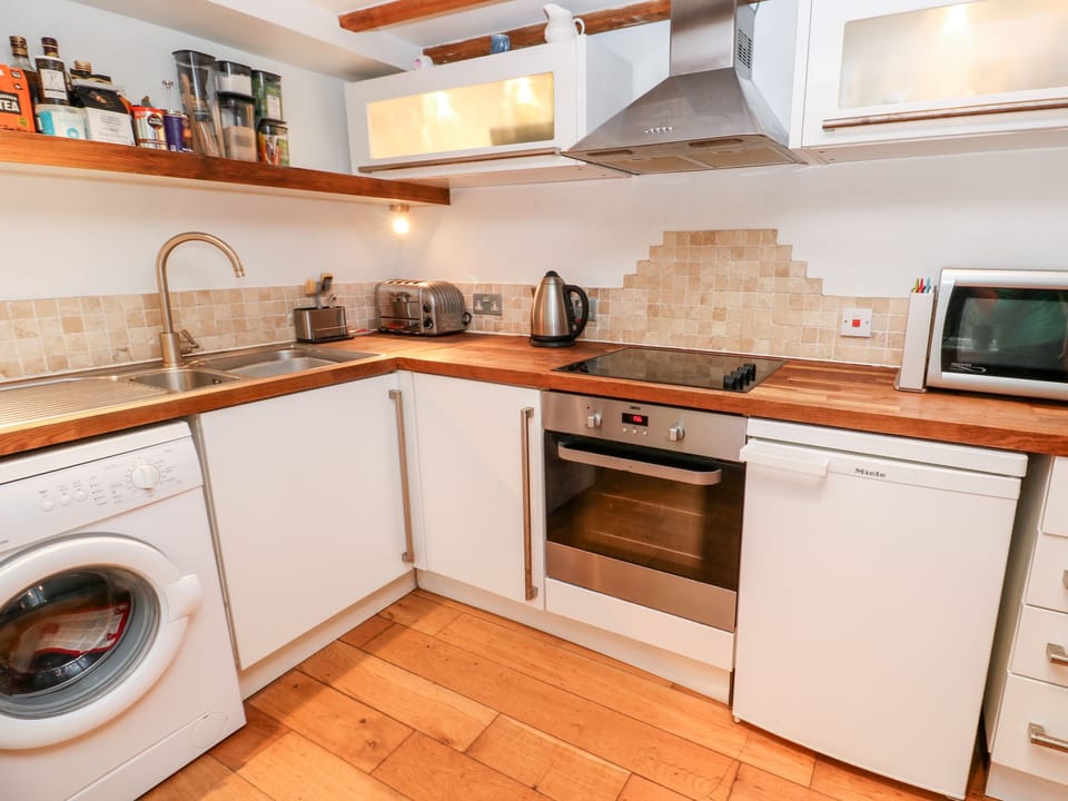 Fridge, electric kettle, toaster, cookware/dishes/utensils