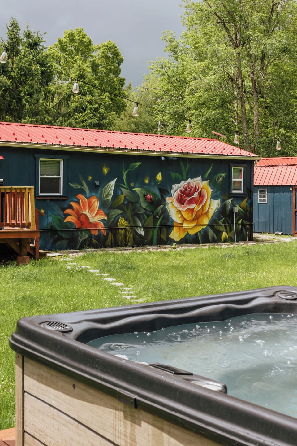 Soak under the open sky in your private hot tub, tucked into the backyard and surrounded by nature. Serenity and relaxation come easy in this peaceful retreat.