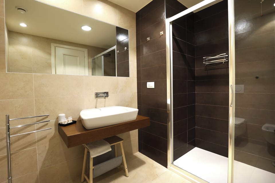 Family Quadruple Room | Bathroom | Shower, rainfall showerhead, hair dryer, bidet