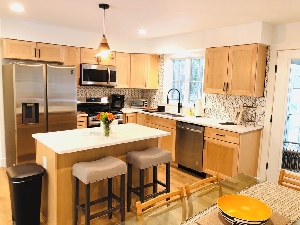 Two countertop stools provide additional seating