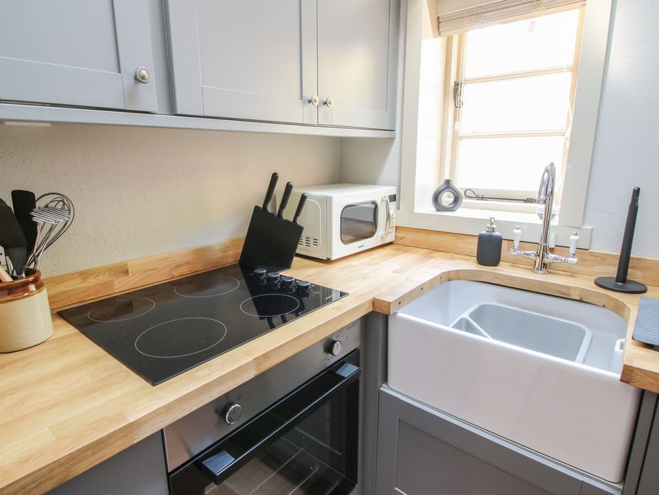 Fridge, electric kettle, toaster, cookware/dishes/utensils