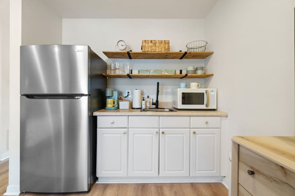 Kitchenette with refrigerator, microwave, keurig, sink