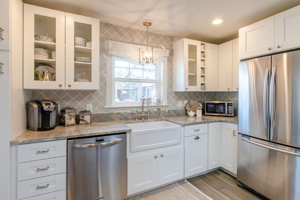 Lovely counters, a convenient wine rack, and farmhouse sink