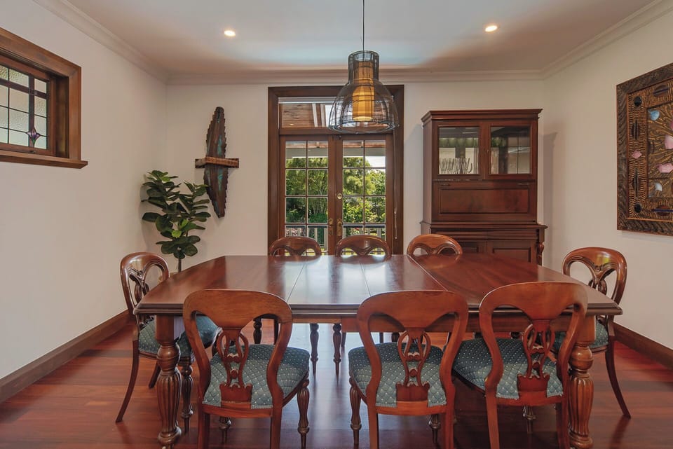 Formal dining room - French doors open to balcony and provide views to the pool