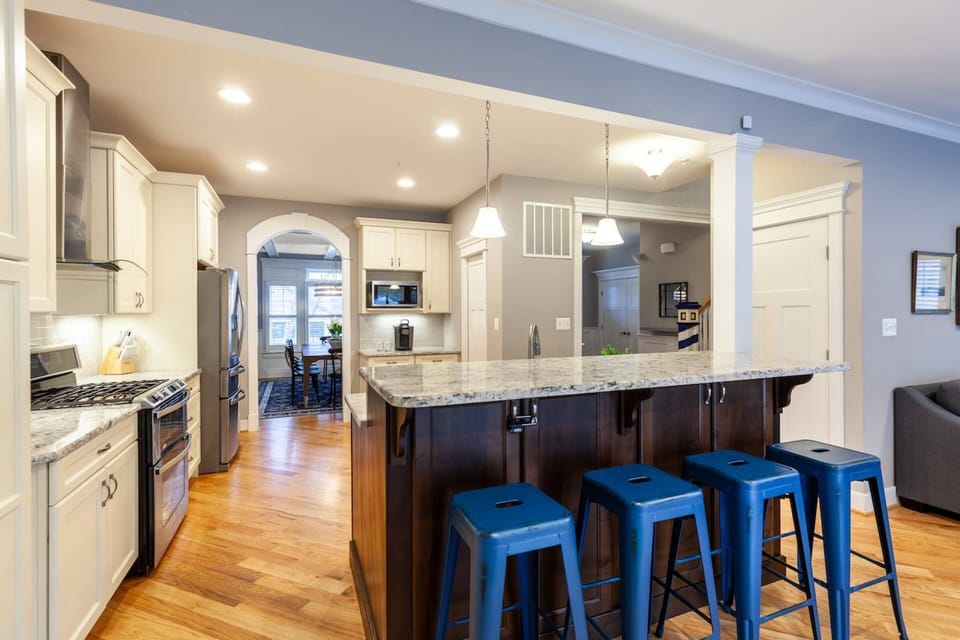 The open gourmet kitchen has all the bells and whistles to cook a large family meal.