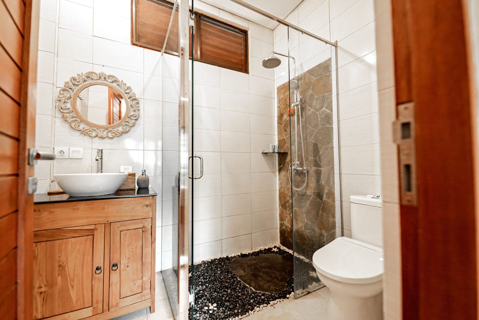 Shower, rainfall showerhead, hair dryer, towels