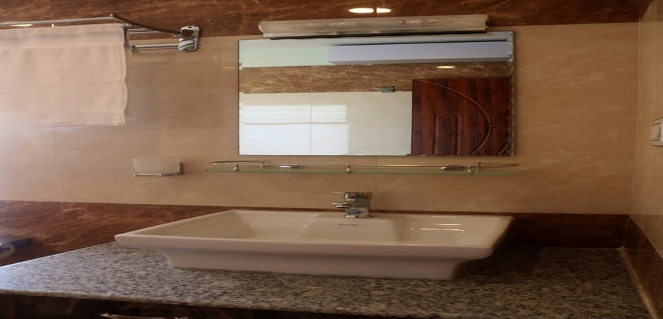 Shower, rainfall showerhead, towels, soap