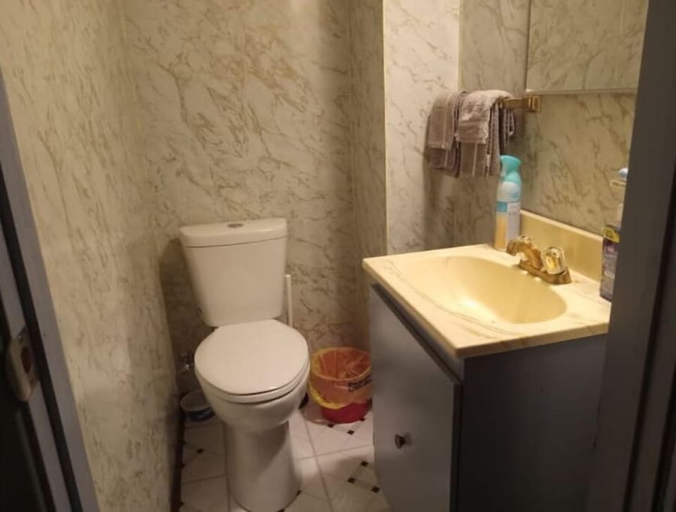 Basement Level 
Half Bath, Toilet and Sink.