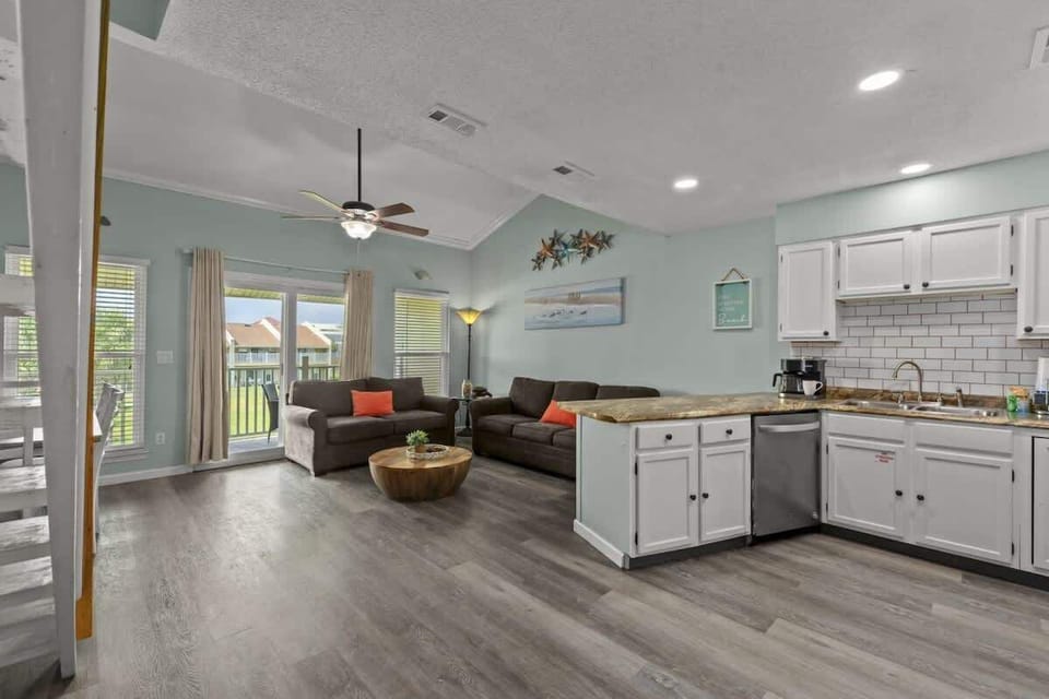 The kitchen area has an open concept to the living room for enjoying your meals and time together.