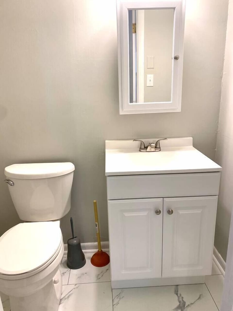 Half-bath, located in the primary bedroom.