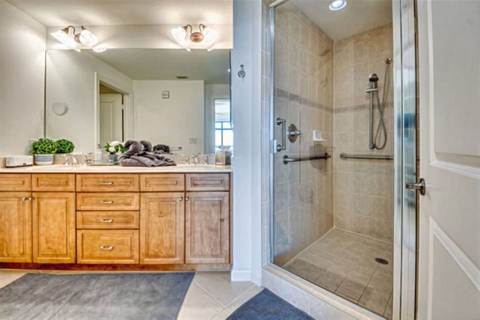 The Master Bath has a large walk-in shower with an adjustable shower head. It also has  his & her sinks, and a private toilet closet.