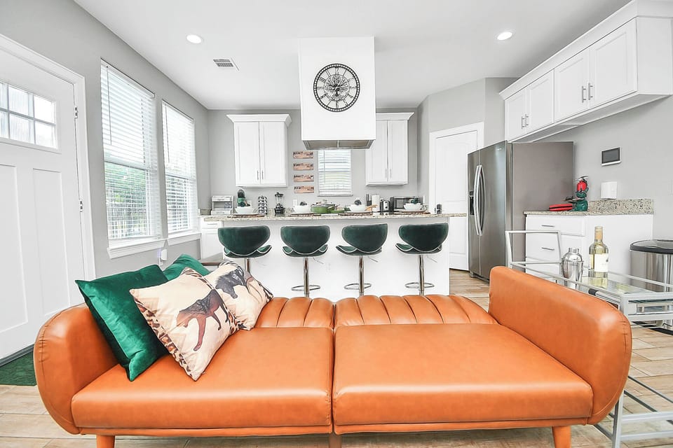 The Melanated Way Living Room with Sofa Bed and Kitchen View