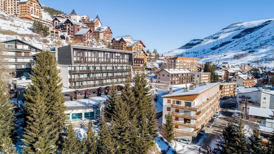 Take in the view of the mountain massif surrounding the resort.