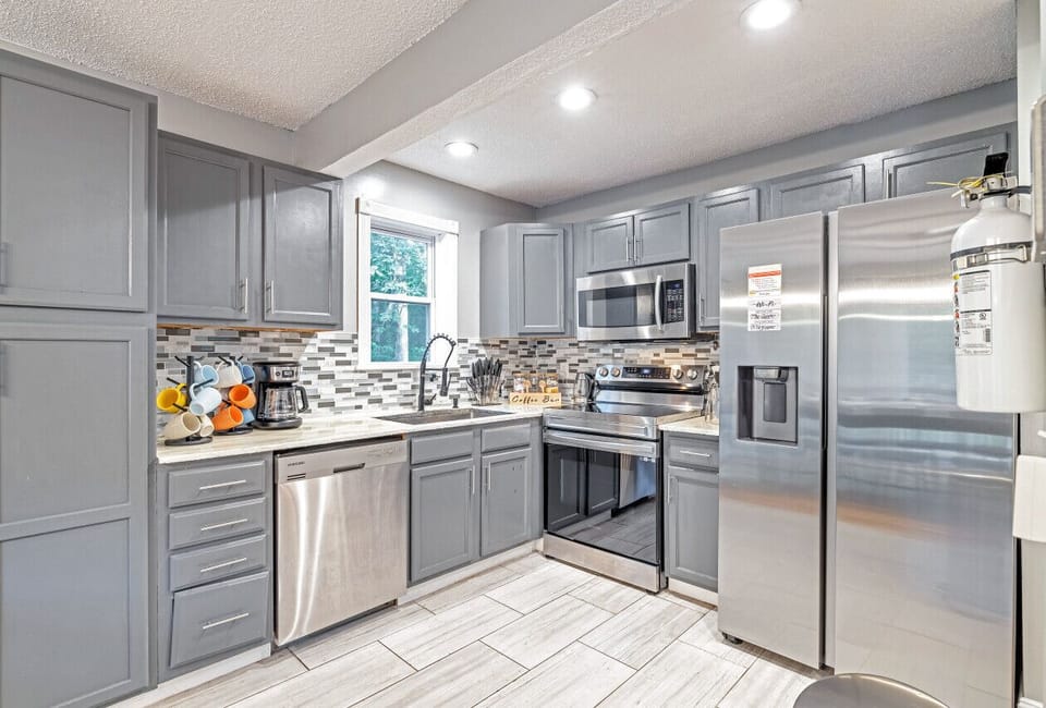 Fully equipped kitchen with modern appliances and plenty of space to prepare meals together.