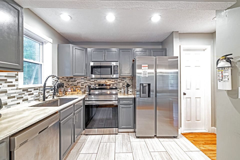 Another view of the spacious kitchen with modern appliances and ample counter space.