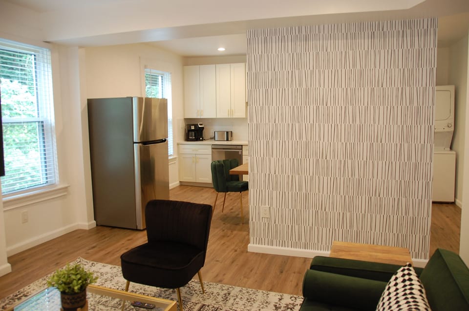 Living room looking to kitchen/dining area