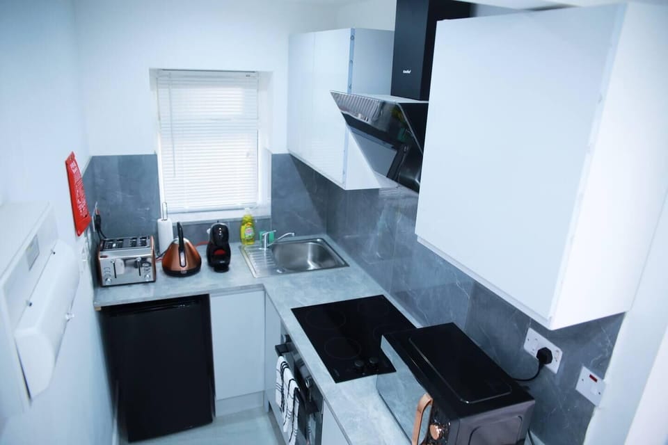 Kitchen fully equipped with utensils.