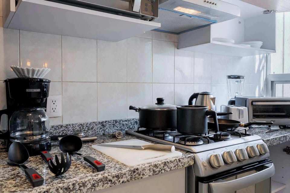Prepare meals with ease in our stocked kitchen.


