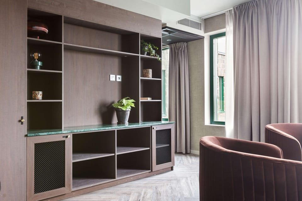 Suite, 1 King Bed, Non Smoking | In-room safe, individually decorated, individually furnished, desk