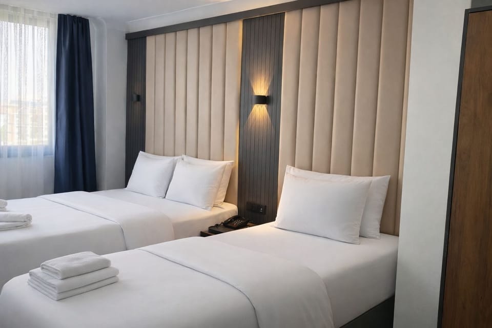 Economy Triple Room | Premium bedding, down comforters, minibar, in-room safe