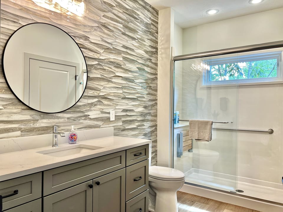 Relaxing main level bathroom with hallway access