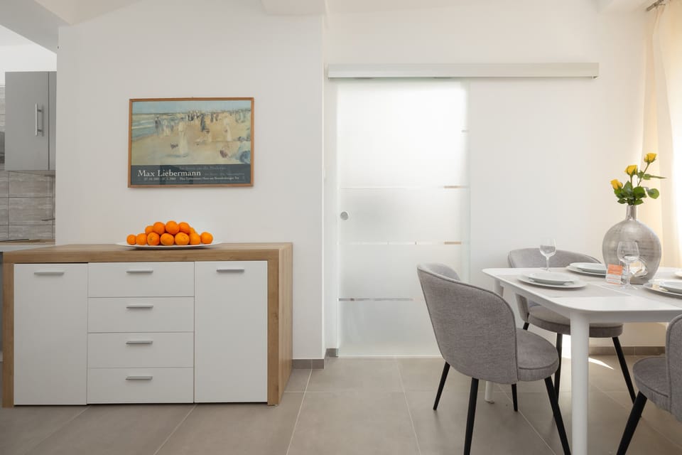 A close-up of a modern dresser with fresh fruit and decorative elements adding warmth to the space.
