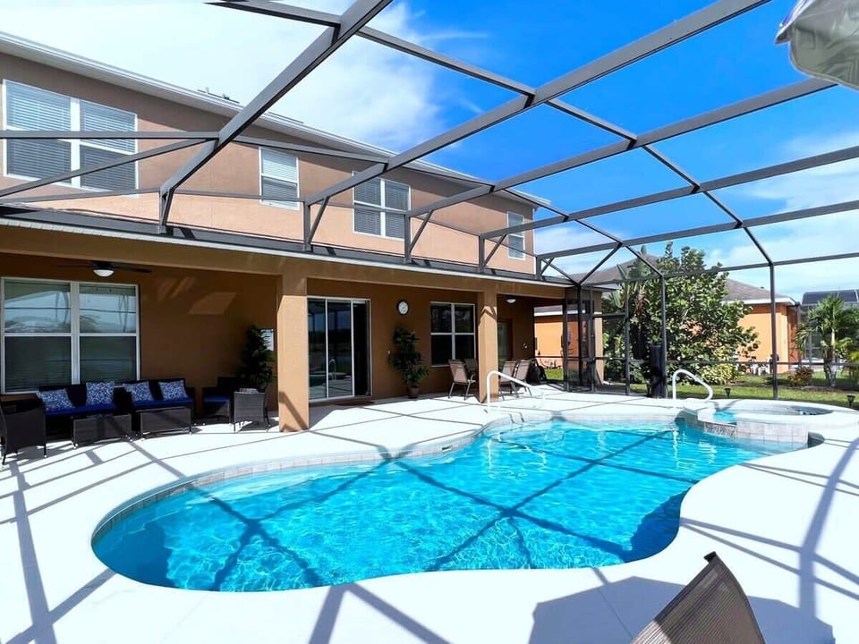 Relax by your private pool and spa with comfortable outdoor seating, perfect for soaking up the Florida sunshine. There are no rear neighbors with a lake view.  Optional pool heat is available for an additional fee during cooler months.