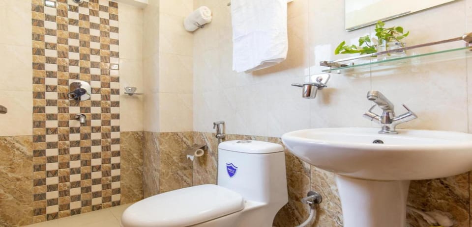 Shower, rainfall showerhead, towels, soap