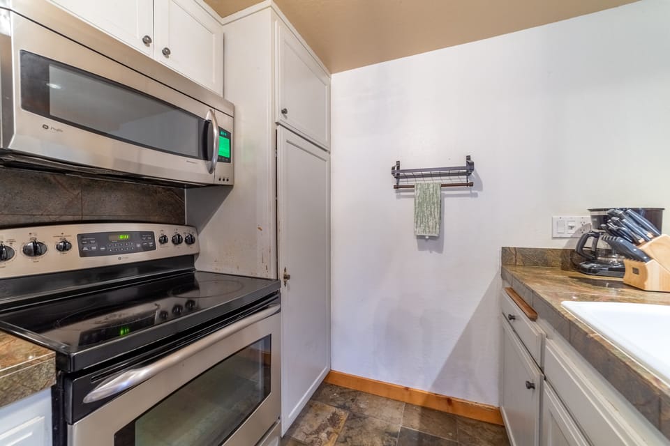 Kitchen with stainless steel appliances.