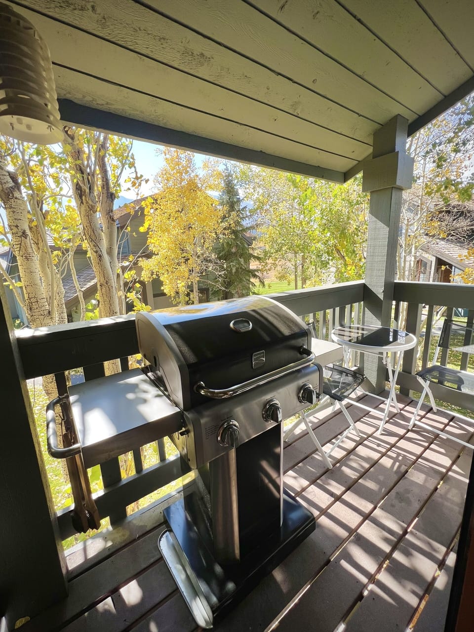 Private deck with BBQ and small seating area.