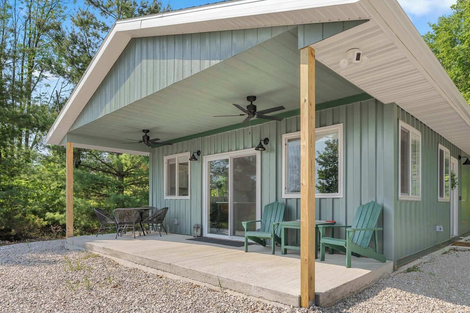 Guests will enjoy the covered porch, complete with outdoor fans and several seating options