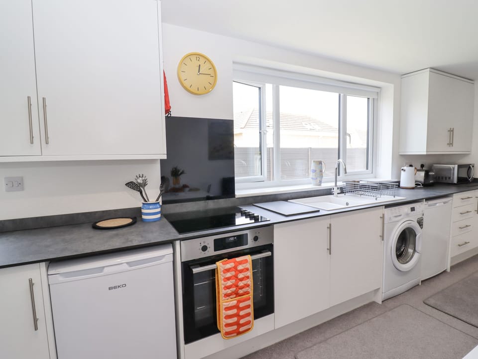 Fridge, electric kettle, toaster, cookware/dishes/utensils