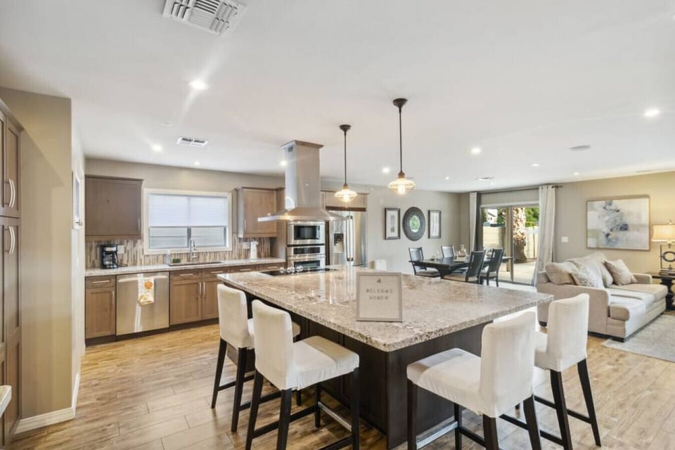 Open-concept great room: kitchen + dining + living area