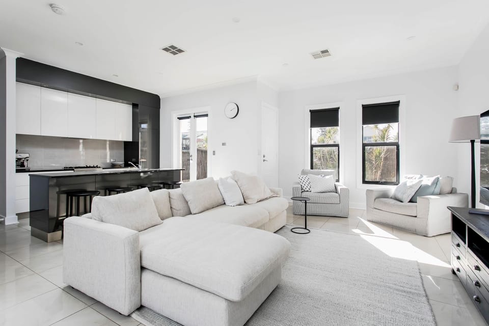 Lounge Room - downstairs off kitchen with large sofa and smart TV