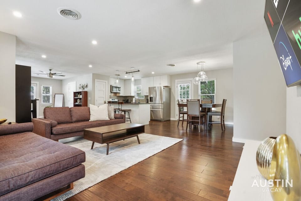 Open concept living room with large smart tv