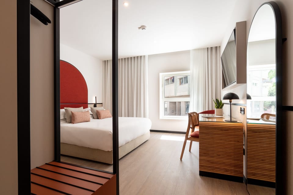 Double Room, Ground Floor | Minibar, in-room safe, laptop workspace, blackout drapes
