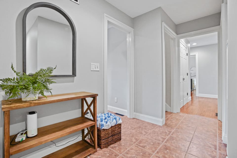 Entryway from the garage. Such a light and airy space to be welcomed into.