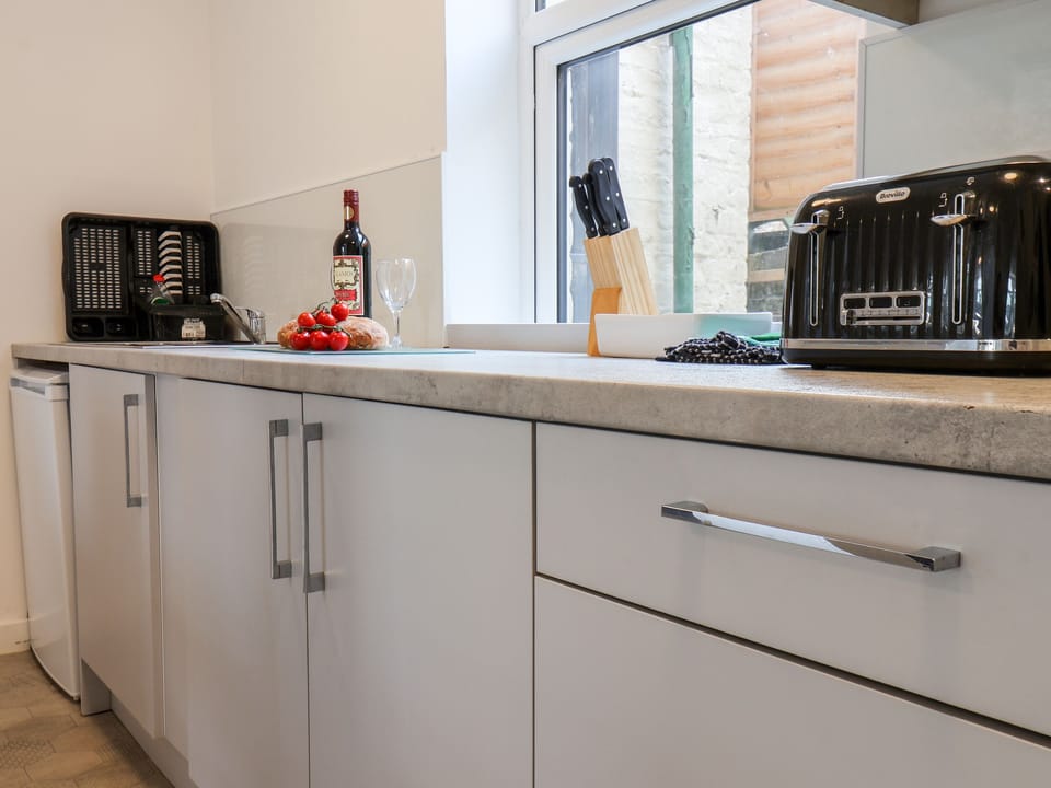 Fridge, electric kettle, toaster, cookware/dishes/utensils