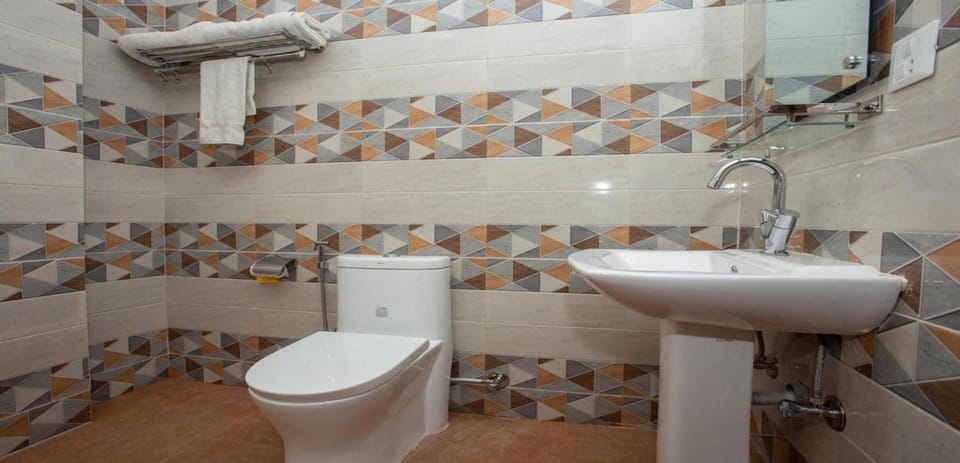Shower, rainfall showerhead, towels, soap
