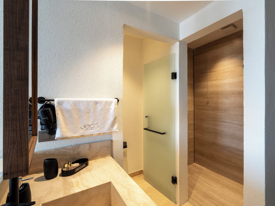 Shower, free toiletries, hair dryer, slippers