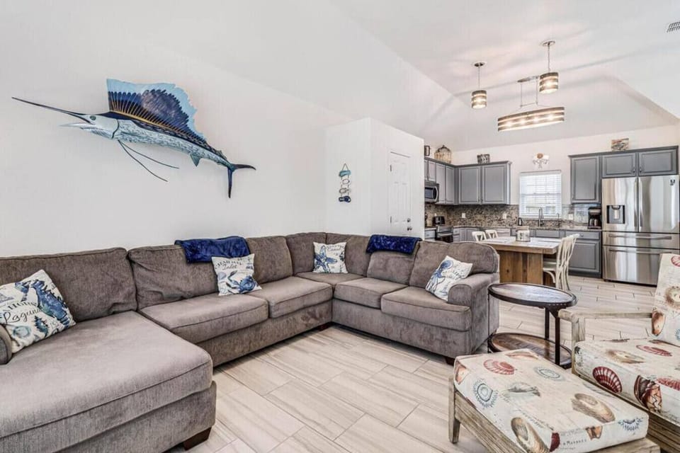 Relax and recharge in this airy, beach-themed living space