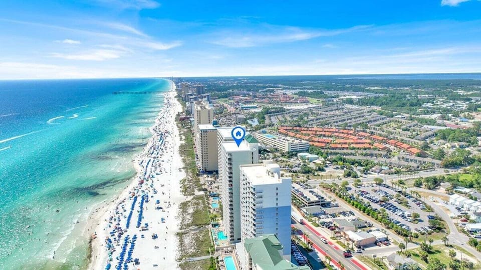 The resort sits directly on Front Beach Road, within walking distance of popular restaurants and attractions, and just a short drive to Pier Park