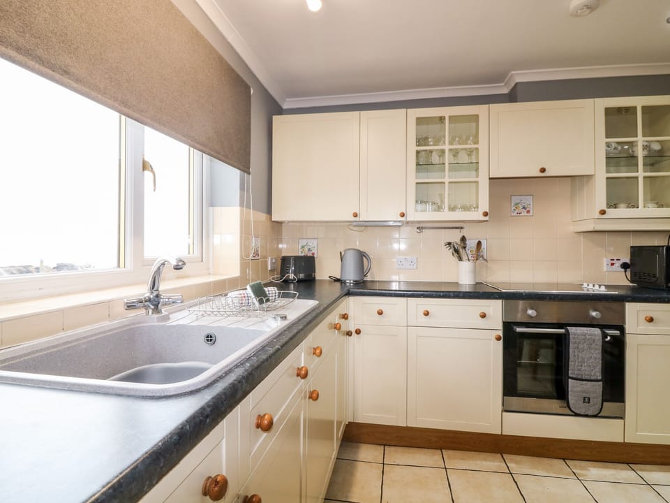 Fridge, electric kettle, toaster, cookware/dishes/utensils