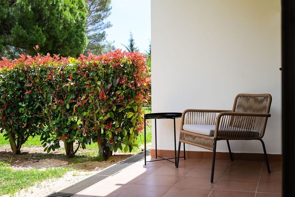Discover a cozy nook on the patio, perfect for a morning coffee or an evening read amidst vibrant foliage.
#PatioSeating #QuietSpot #LovelyStay