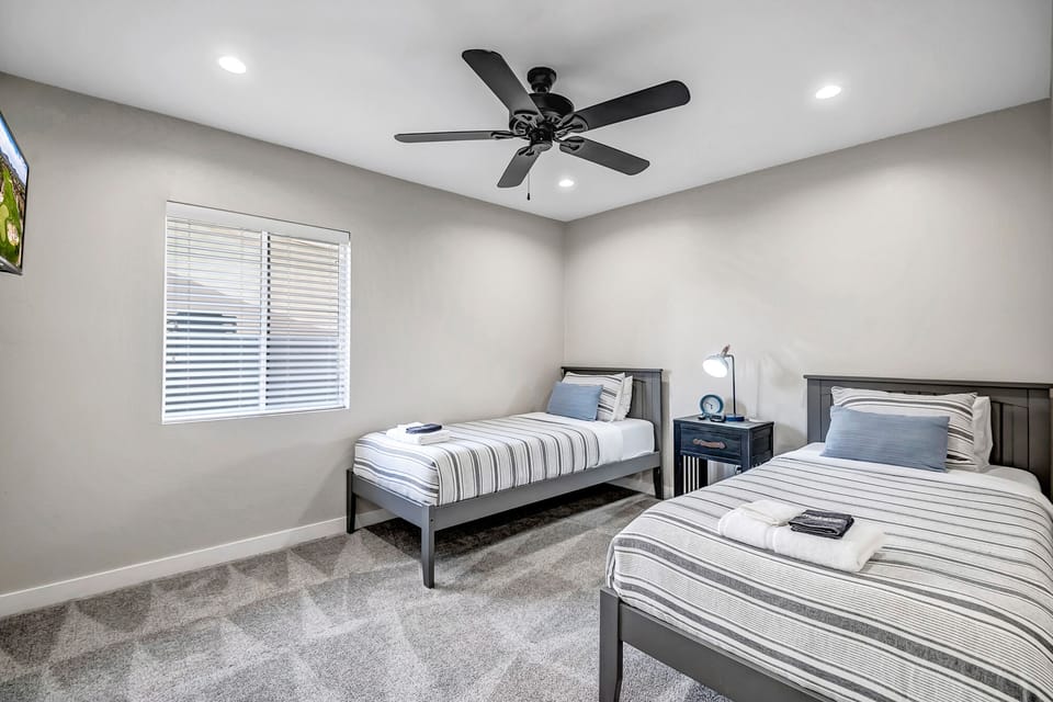 Bedroom 2 with two XL twin beds and Smart TV