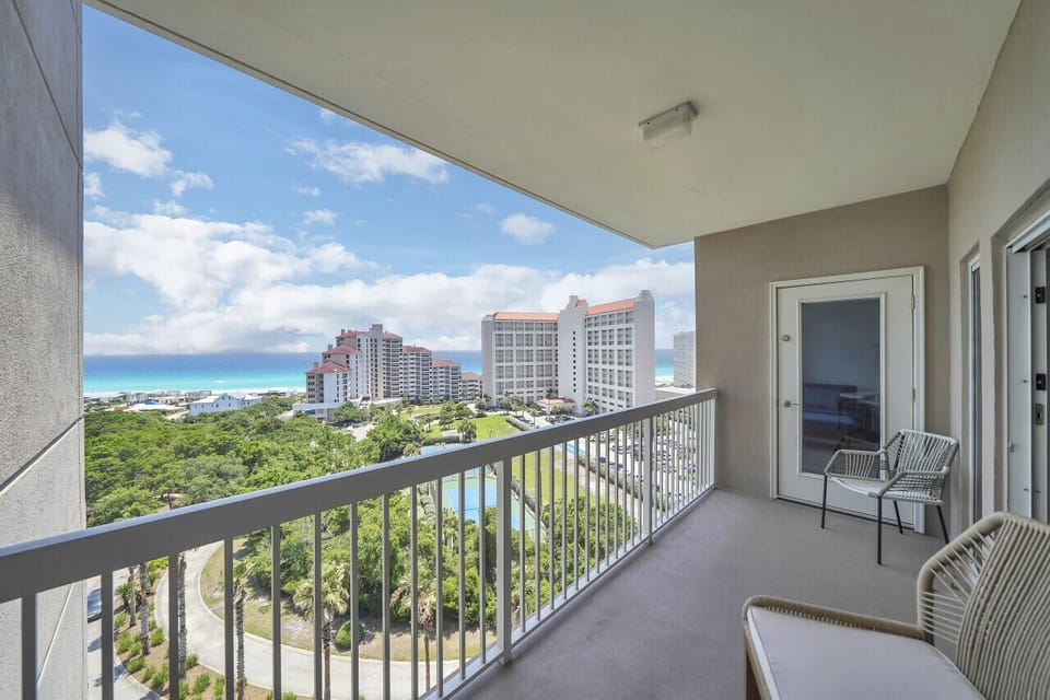 Gulf of Mexico, Tops'l Beach Resort, and sandy beach harmonize in breathtaking coastal symphony. #ParadiseTrilogy