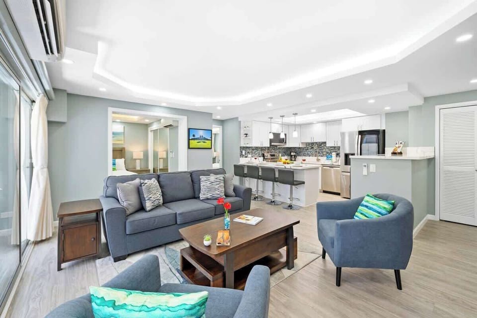 Gather with your family or friends in the living room with a queen-sleeper sofa, 2 chairs and a coffee table!